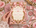 A hand holding a pink and gold invitation card with a pink ribbon and flowers, surrounded by pink roses, pearls, and a pink wax seal.