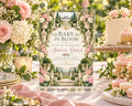 A beautifully decorated baby shower invitation featuring a garden scene with a castle, surrounded by pink and white flowers, and a table with cakes and other desserts.