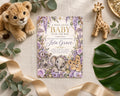 A baby shower invitation featuring a lion, zebra, and elephant illustration, surrounded by plush toys and greenery.