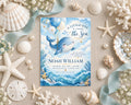 a baby shower invitation for Noah William, with a blue and white ocean theme. The invitation is surrounded by seashells, starfish, and pearls, creating a nautical and beachy atmosphere.