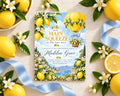 a baby shower invitation with a lemon and flower theme, surrounded by lemons, flowers, and a blue ribbon.