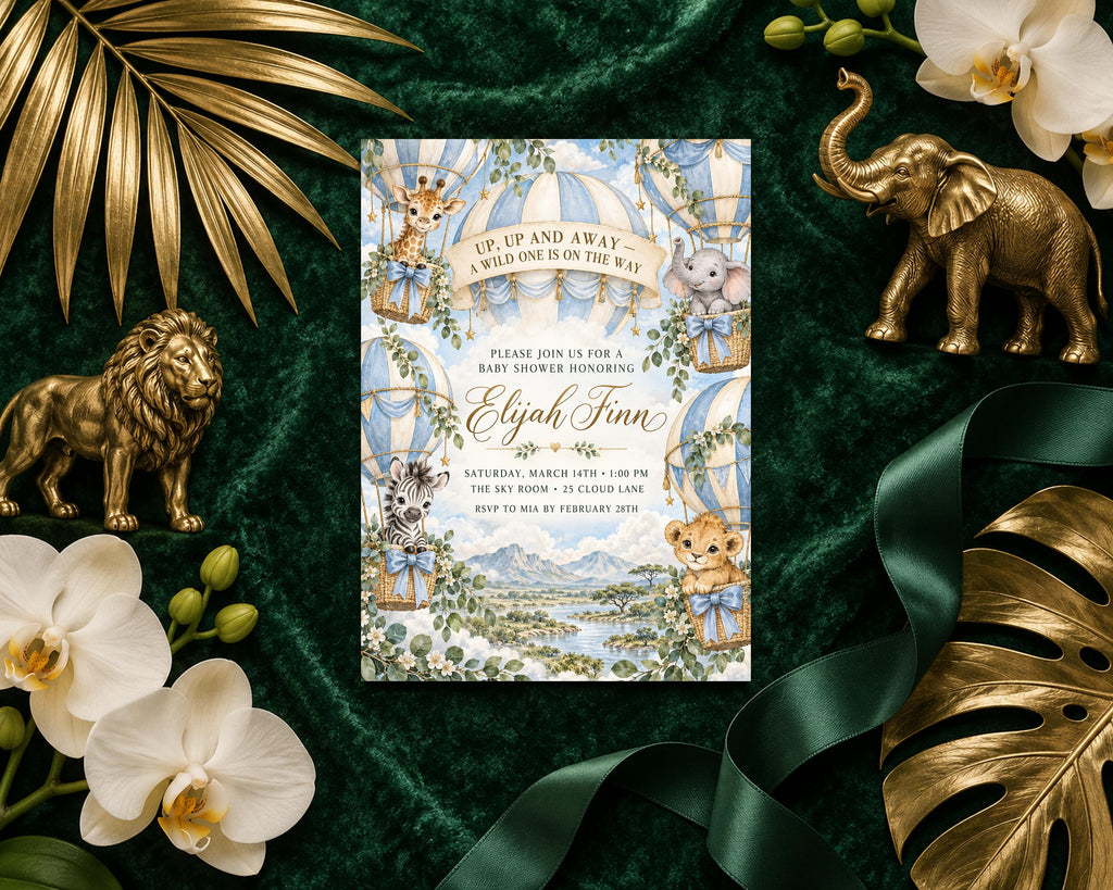 a baby shower invitation with a tropical theme, surrounded by decorative elements such as gold leaves, orchids, and a gold elephant figurine.