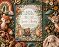 A colorful invitation card with illustrations of animals and flowers, surrounded by stuffed animals and natural elements like flowers and leaves.