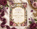 A beautifully designed invitation card for a baby shower, featuring a butterfly theme with purple and pink flowers surrounding it.