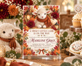 A baby shower invitation featuring a lamb and autumn decorations, with a table displaying cookies and other festive items.