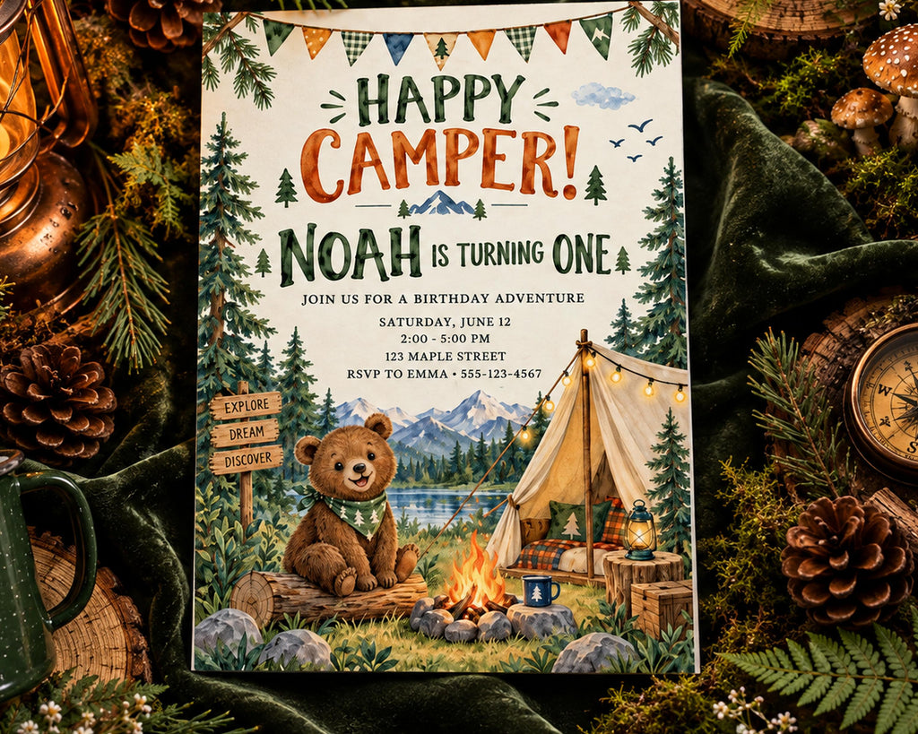 The image is a birthday invitation for Noah, who is turning one, featuring a teddy bear, a tent, and a campfire, surrounded by pine cones and other natural elements.