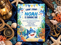 The image is a birthday invitation for a child named Noah, featuring a shark theme with illustrations of sharks, starfish, and other marine life. The invitation is surrounded by various nautical and beach-themed items, such as a lantern, seashells, and an anchor, creating a nautical atmosphere.