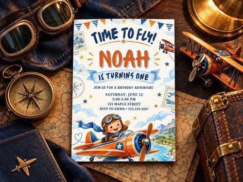a birthday invitation for a boy named Noah, with a colorful airplane illustration and the text "Time to fly! Noah is turning one". The invitation is surrounded by various objects, including a pair of sunglasses, a compass, and a suitcase, suggesting a travel theme for the boy's birthday party.
