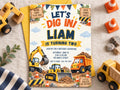 The image is a birthday invitation for a child named Liam, who is turning two years old. The invitation features illustrations of construction vehicles and a construction site theme, along with the text "Let's Dig In! Liam is Turning Two" and "Join us for a birthday adventure".