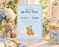 The image is a baby shower invitation featuring a teddy bear on a crescent moon, surrounded by flowers and other baby-themed decorations.