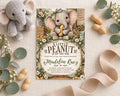 a baby shower invitation with a cute elephant illustration, surrounded by various baby-related items such as peanuts, flowers, and a stuffed elephant toy.