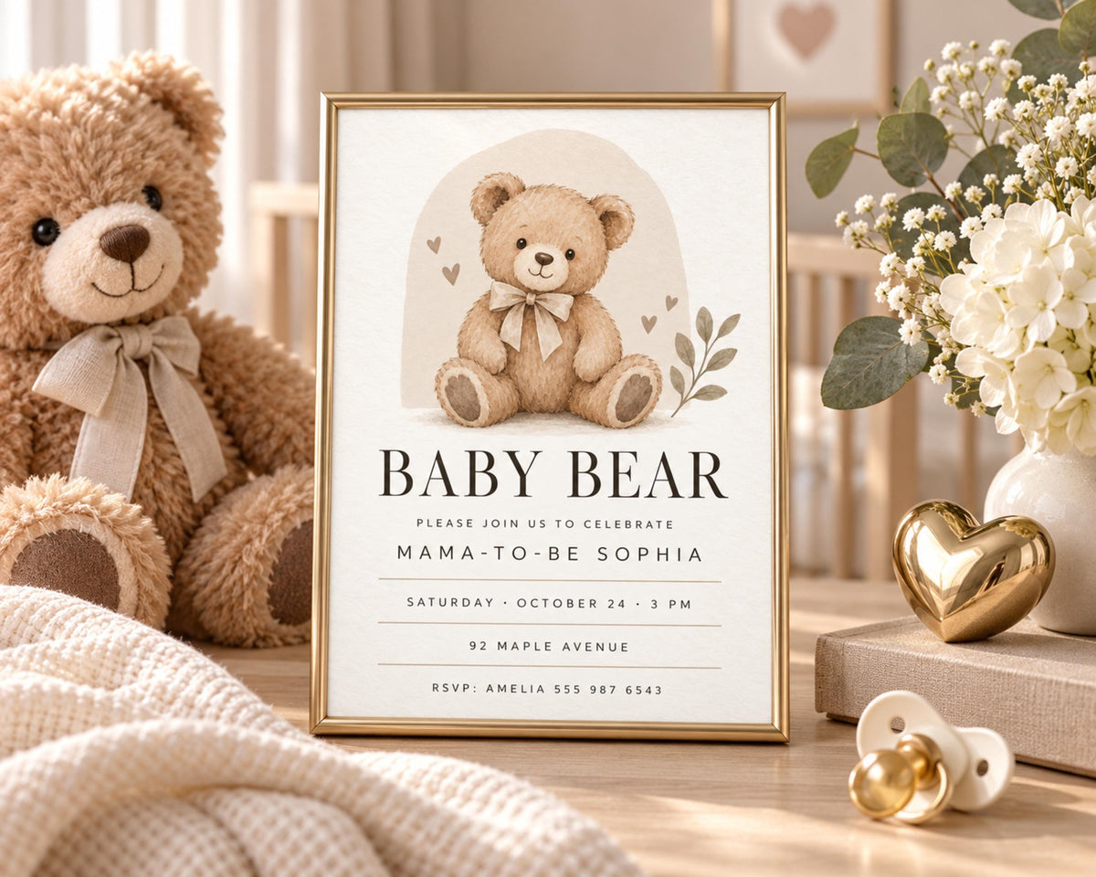 a baby bear-themed invitation with a teddy bear illustration, placed on a table with a vase of flowers and a pacifier.