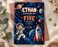 The image is a birthday invitation for a child named Ethan, who is described as a "blazing off to five" and is celebrating his fifth birthday. The invitation features a space theme with a rocket ship, planets, and stars, along with a cartoon astronaut.