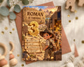 The image is a birthday invitation for a child named Roman, who is turning three years old. The invitation features a cartoon image of a young boy dressed in a safari hat, standing next to a camel, with a desert landscape in the background. The text on the invitation indicates that the event is scheduled for Saturday, June 12th at 2:00 PM, and will be held at the Celebration Lane, RSVP to Sarah: (ss52-5454).