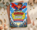 A colorful birthday invitation for a superhero-themed party, featuring a young boy in a superhero costume flying above a city skyline.