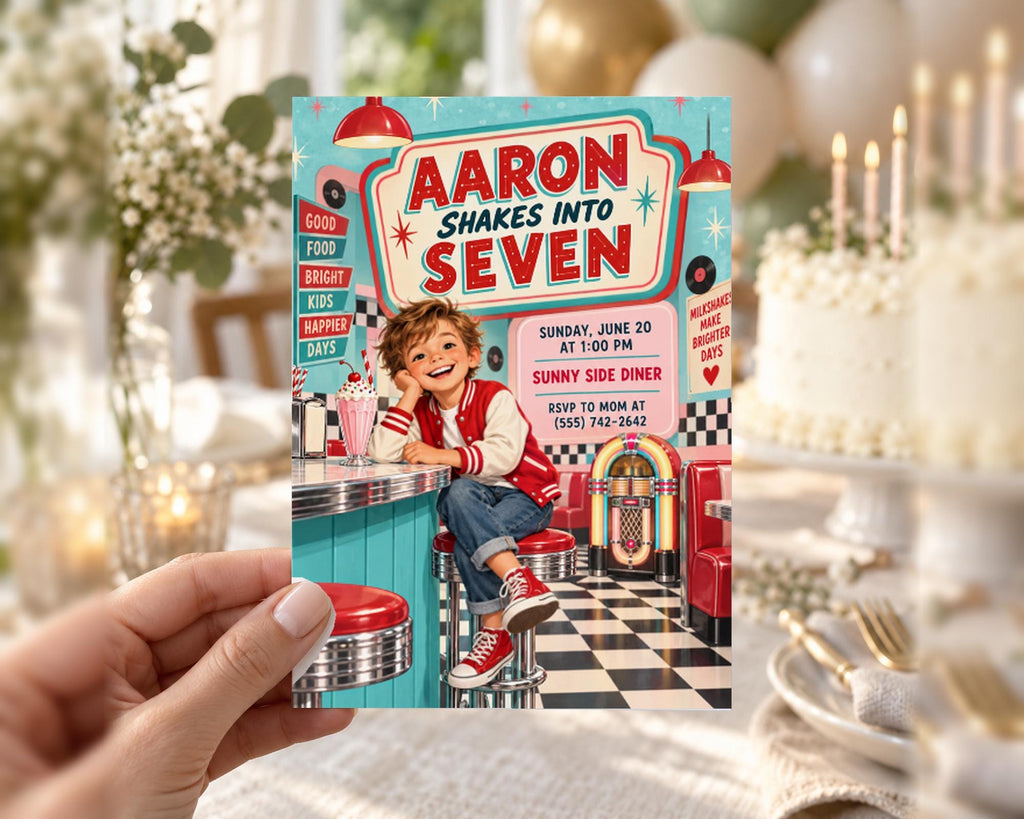 A hand holding a colorful invitation card for a "A Aaron Shakes into Seven" party, featuring a young boy sitting at a diner counter.